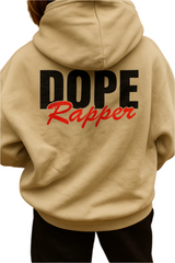 Beige hoodie with 'DOPE Rapper' text on the back, worn by a person.