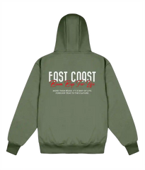 An olive green hoodie shown from the back, featuring a graphic print with the words 'EAST COAST' in white and red, and a quote underneath.