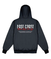 A dark gray zip-up hoodie shown from the back, featuring a graphic print with the text 'FAST COAST' in white, 'Run Rap Too Life' in red script, and smaller white text below, displayed on a solid white background.