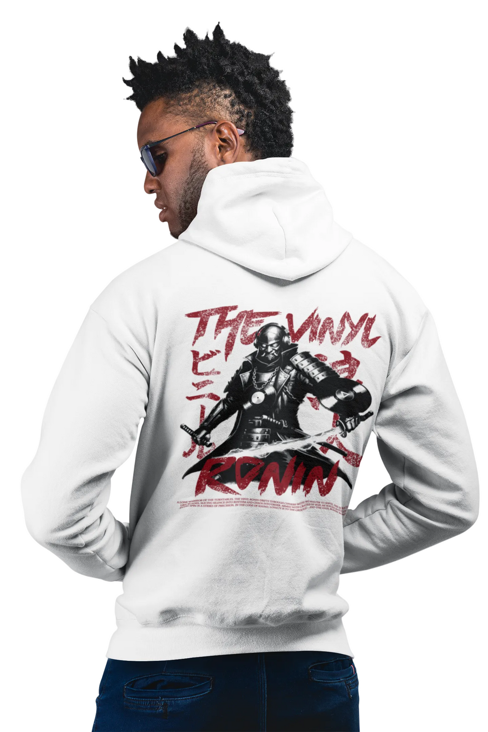 Man wearing a white hoodie with a graphic design on the back, standing against a white background.