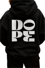 Black hoodie with 'DOPE' printed on the back against a wooden background