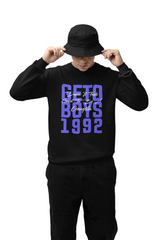 A person wearing a black sweatshirt with the text 'GETO BOYS 1992' in bold blue letters.