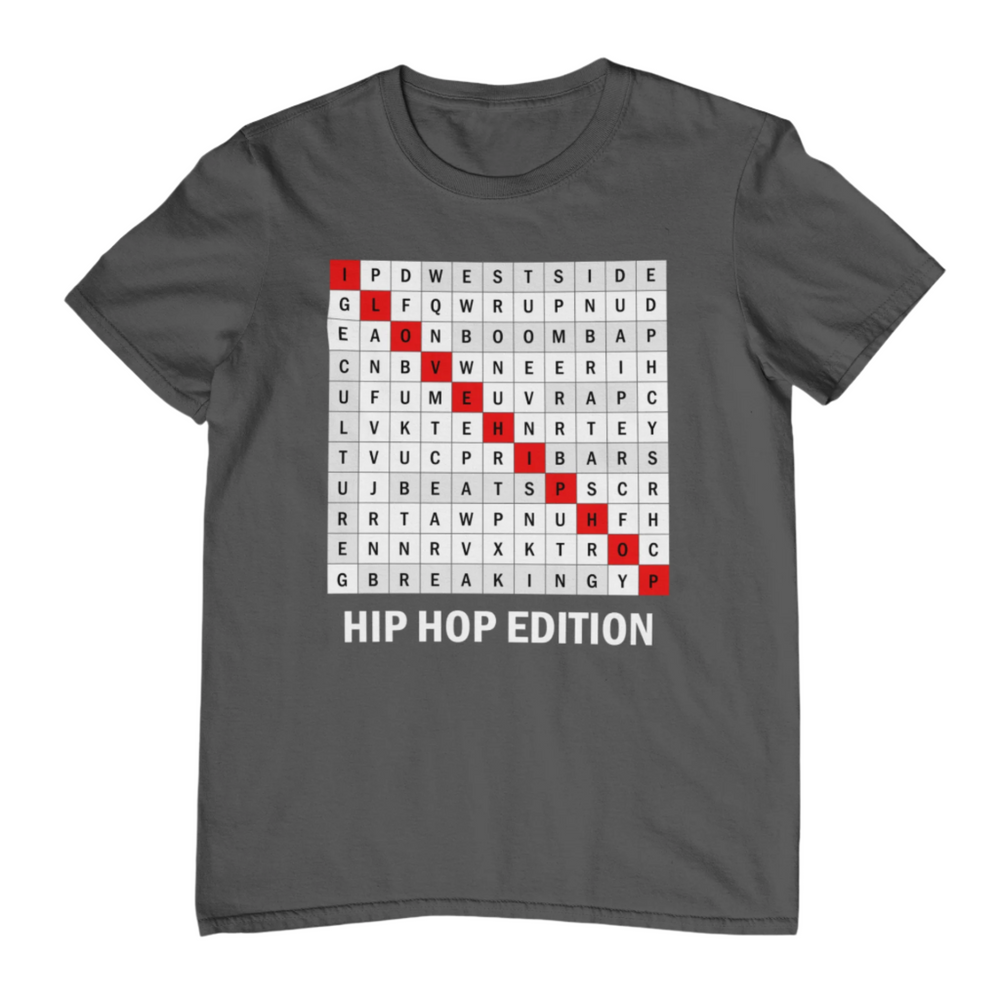 A gray t-shirt with a word search puzzle design featuring words related to hip hop culture, and the text 'HIP HOP EDITION' at the bottom.