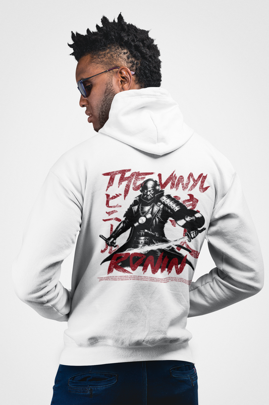 Man wearing a white hoodie with a graphic design on the back, standing against a white background.