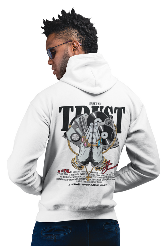 Man wearing a white hoodie with a graphic design on the back, featuring text and hands in a praying position.