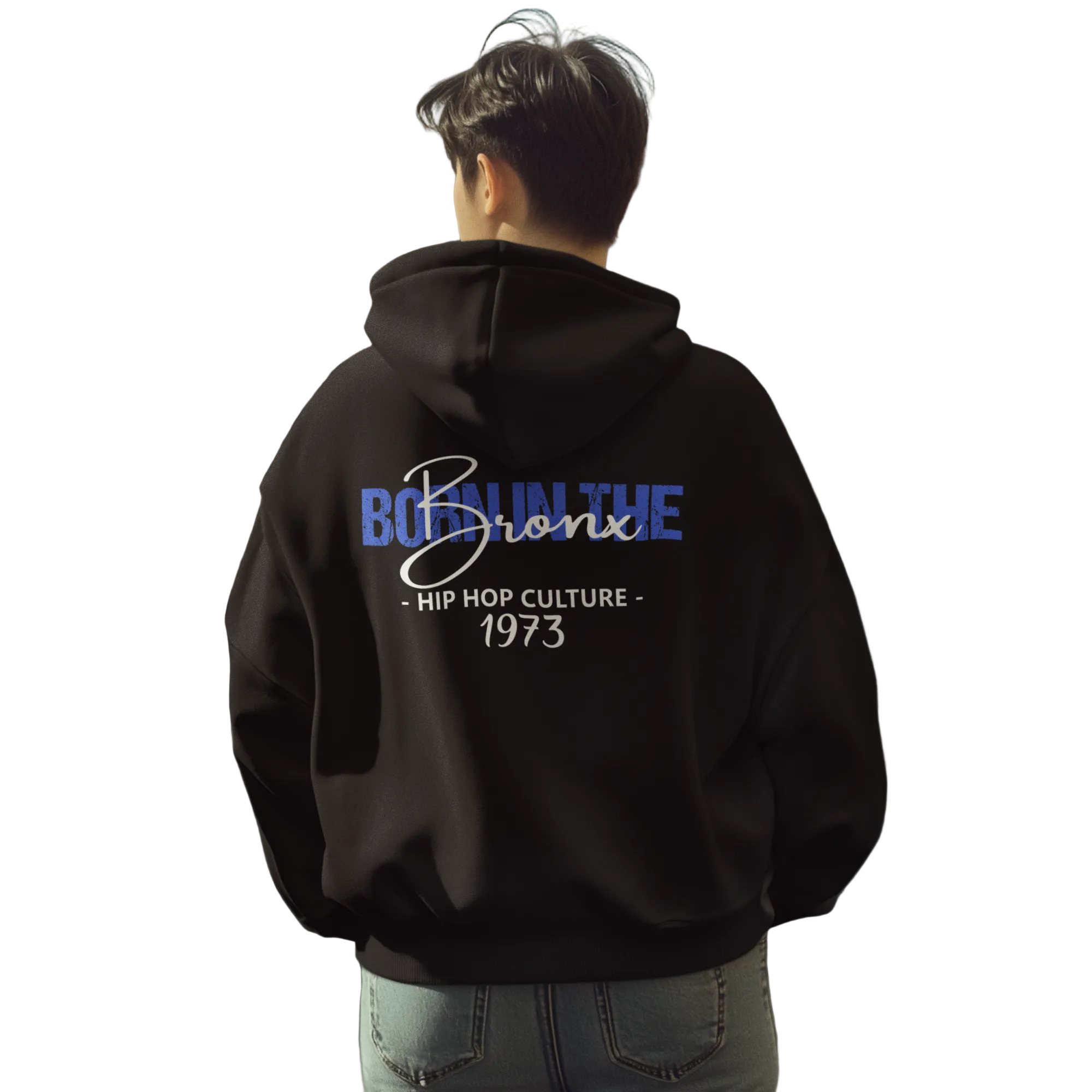 Person wearing a black hoodie with text on the back, standing on a city street.