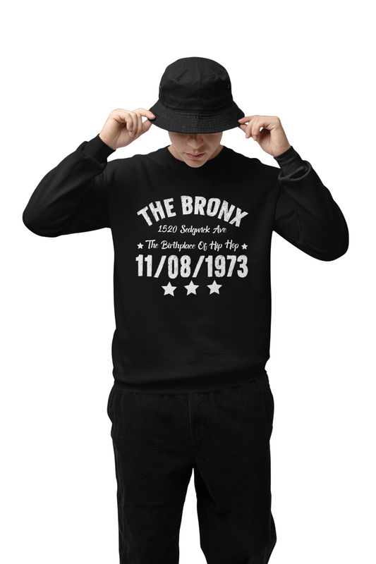Person wearing a black sweatshirt with 'The Bronx' text on a green background