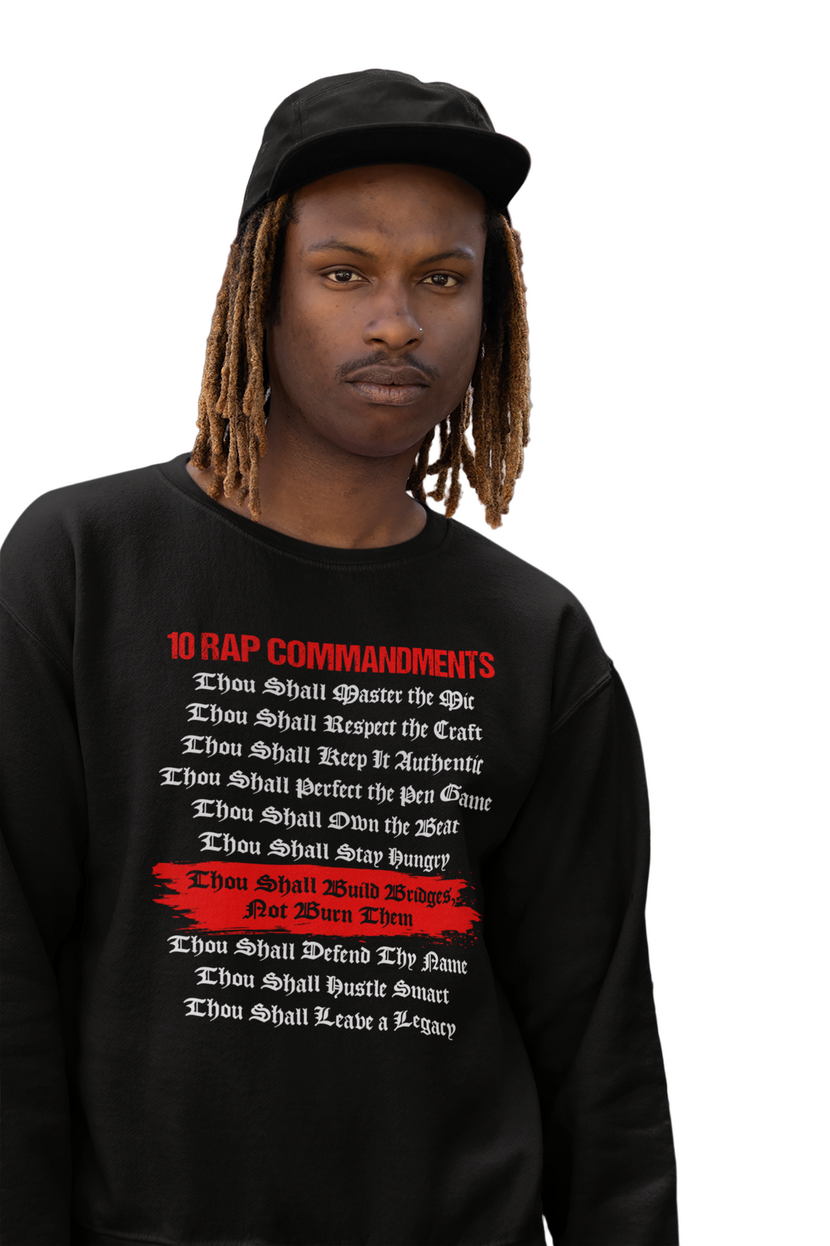 A person wearing a black sweatshirt with text on it standing against a background of a building.