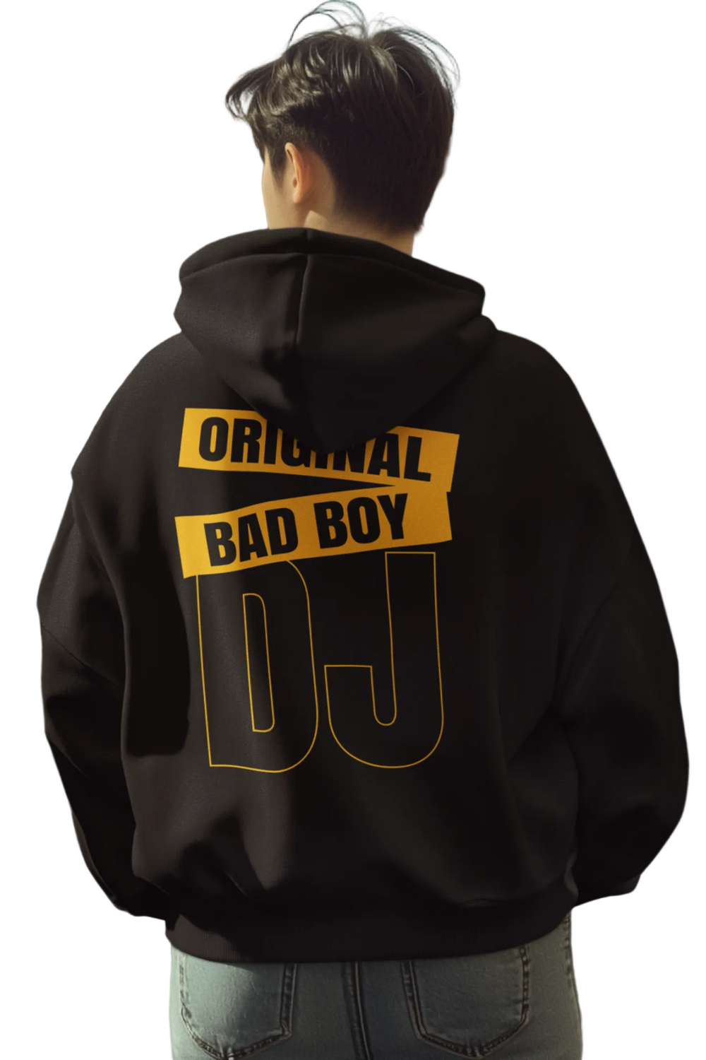 Person wearing a black hoodie with 'Original Bad Boy DJ' text on the back in an urban setting.